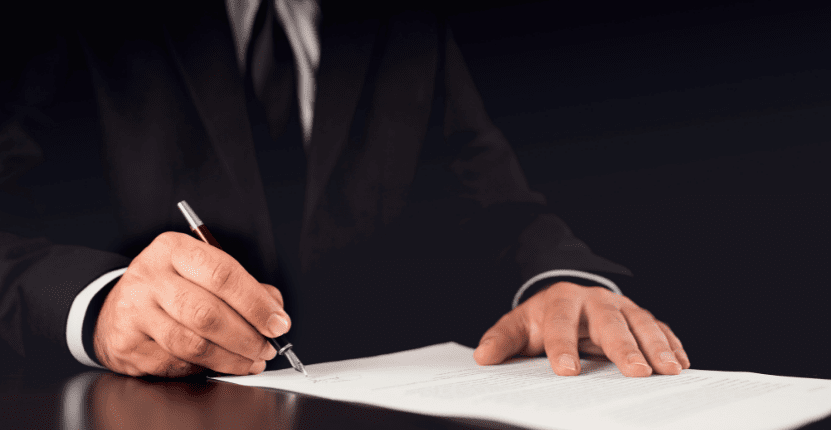 Lawyer Signing a Paper