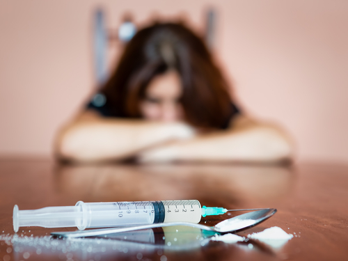 Woman resisting using drugs
