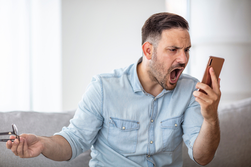 man yelling on phone