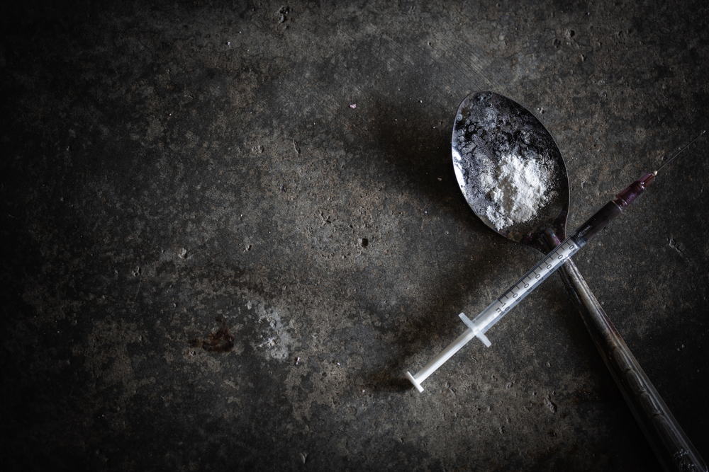 needle and heroin or cocaine powder