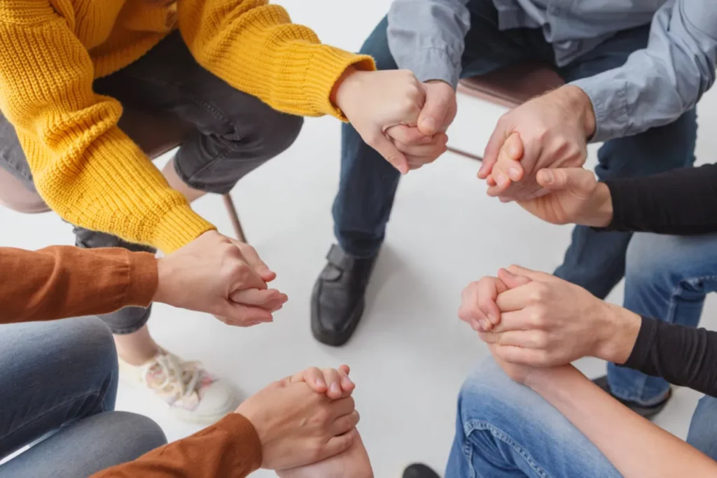 group of people holding hands